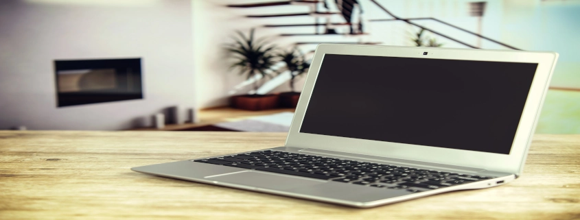 Silver Laptop on Wooden Table